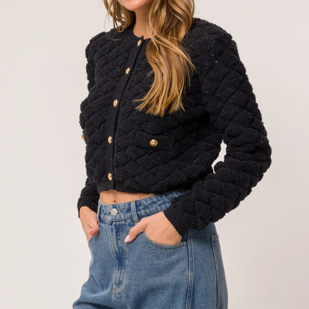 Gilet noir pour femme avec texture et boutons dorés