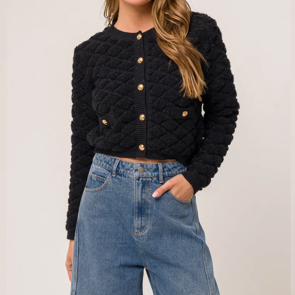 Gilet noir pour femme avec texture et boutons dorés